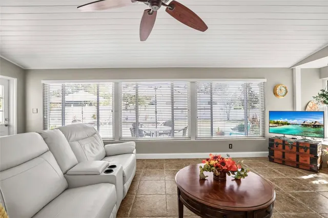 a view of a patio with a table and chairs under an umbrella