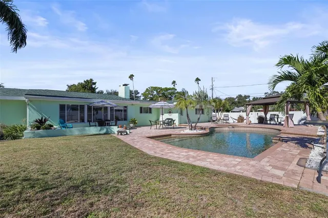 a view of a swimming pool with a patio