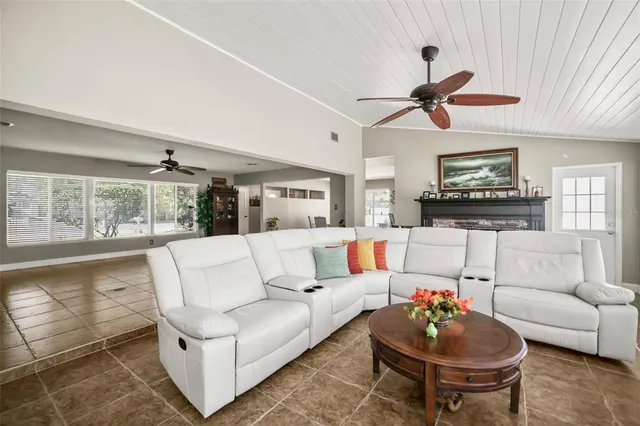 a view of a house with a yard and swimming pool