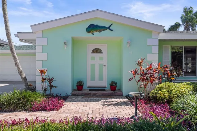 a view of a house with swimming pool and a yard