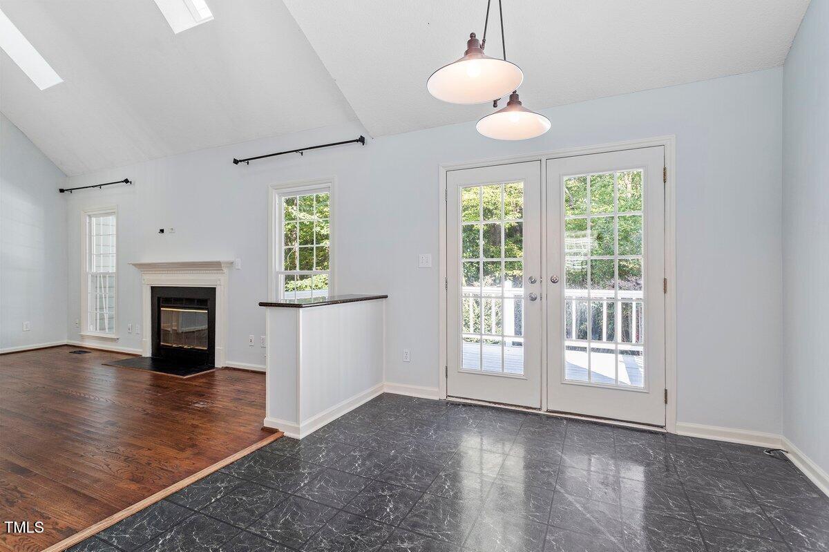 8337 Greywinds Drive Raleigh, NC 27615 - Photo 12 of 27 an empty room with wooden floor and windows