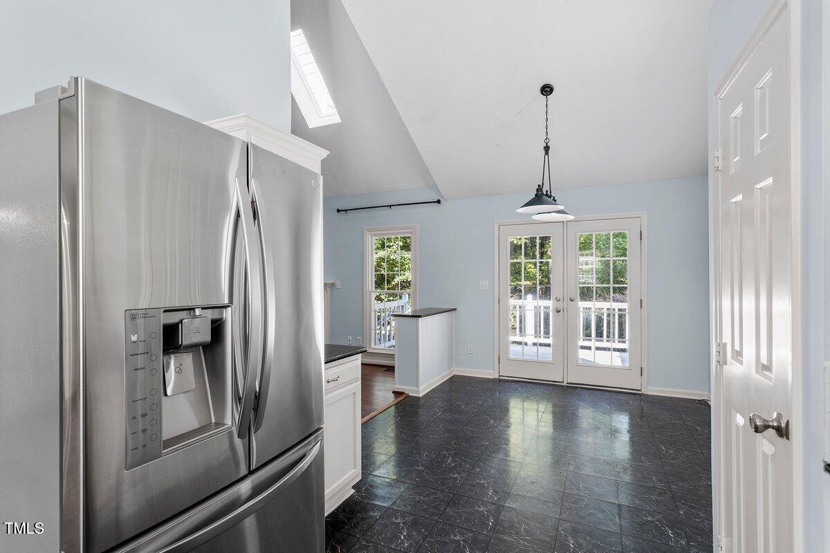 8337 Greywinds Drive Raleigh, NC 27615 - Photo 15 of 27 a kitchen with stainless steel appliances granite countertop a refrigerator a sink and a stove