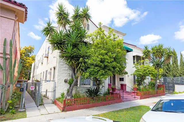 a view of a backyard with a garden and plants