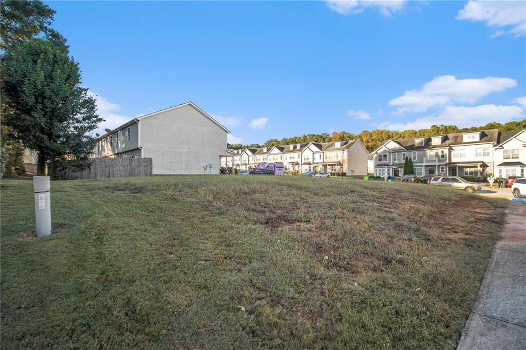 3571 Rock Ridge Drive Rex, GA 30273 - Photo 2 of 5 a view of a yard with an house and trees