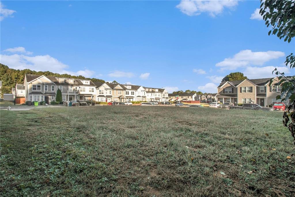 3571 Rock Ridge Drive Rex, GA 30273 - Photo 3 of 5 a view of large trees with a yard