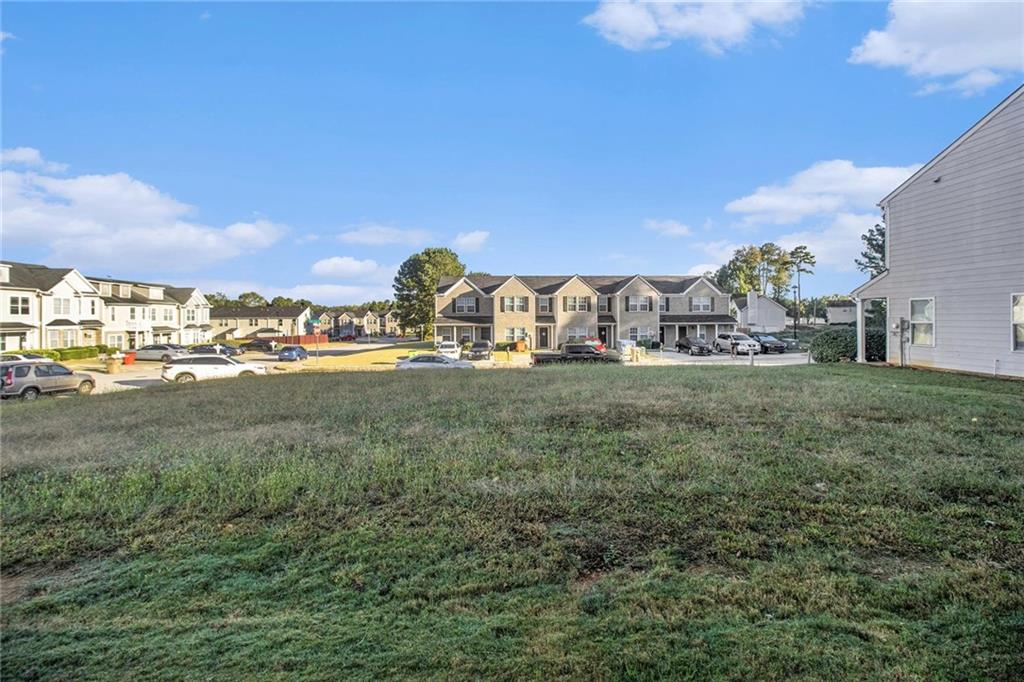 3571 Rock Ridge Drive Rex, GA 30273 - Photo 4 of 5 a view of large trees and outdoor space