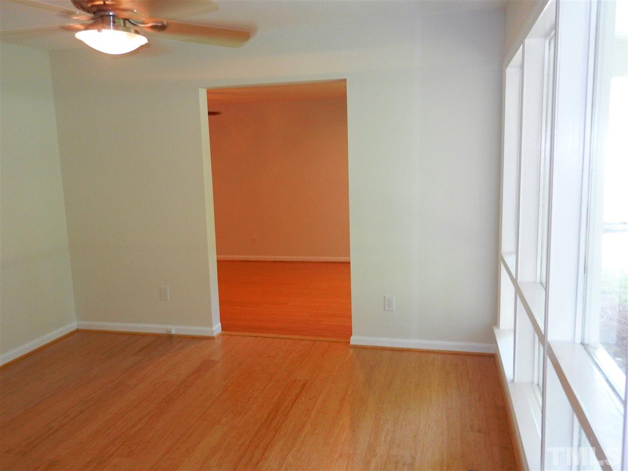 11916 Us 64 A Spring Spring Hope, NC 27882 - Photo 14 of 25 an empty room with wooden floor and windows