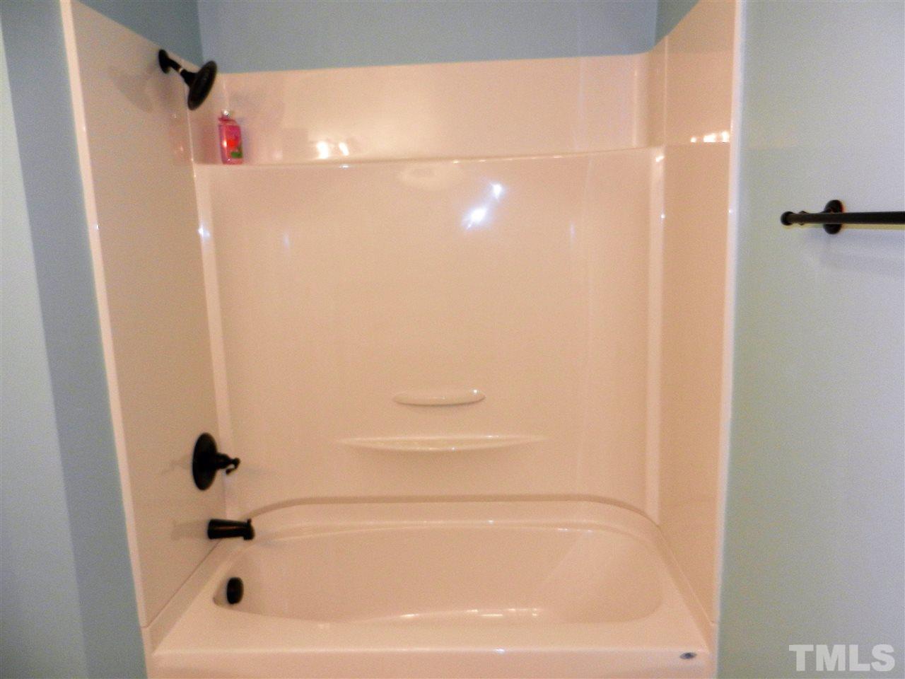 11916 Us 64 A Spring Spring Hope, NC 27882 - Photo 17 of 25 a bathroom with a bathtub