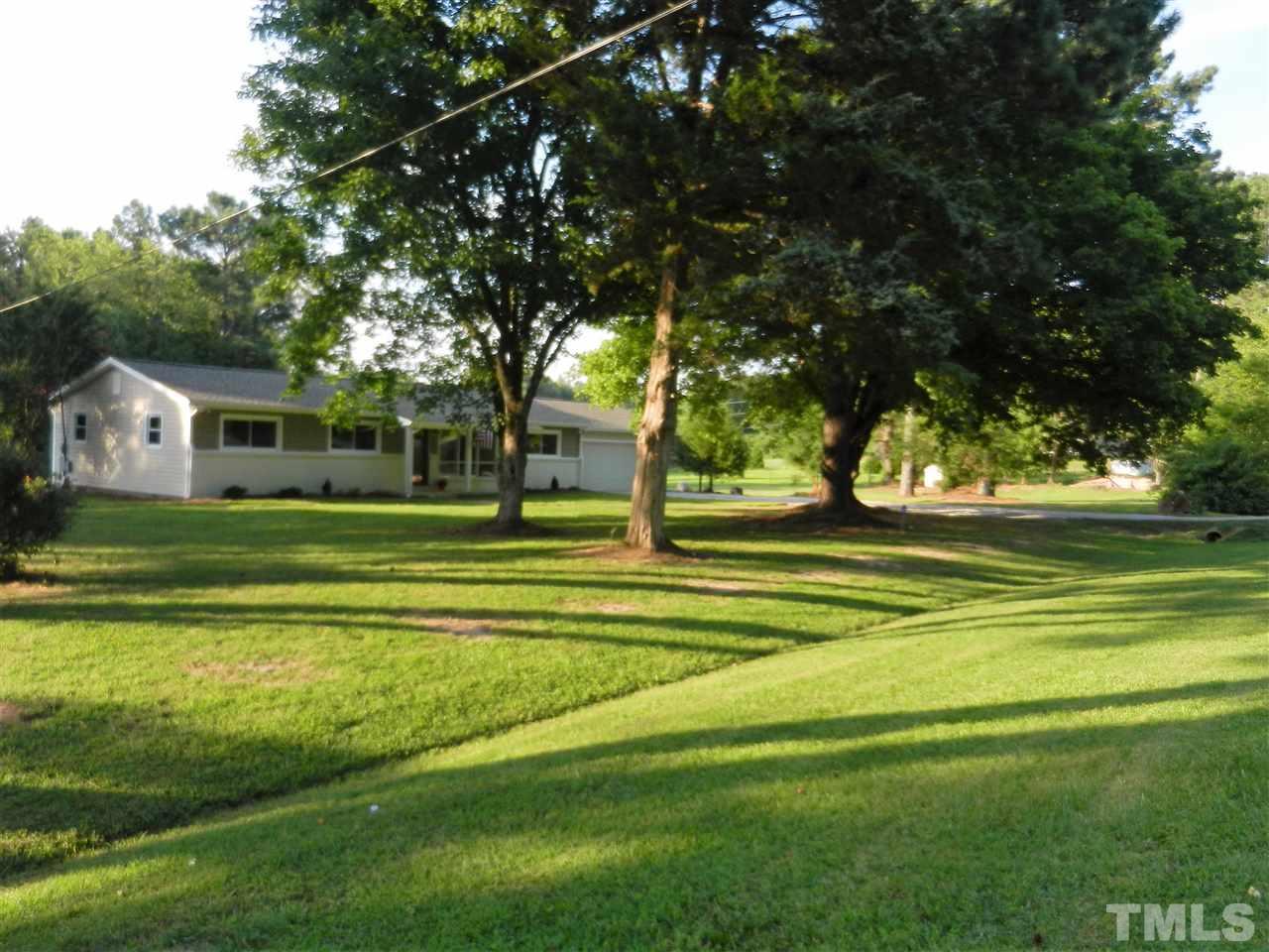11916 Us 64 A Spring Spring Hope, NC 27882 - Photo 21 of 25 a front view of a house with a yard