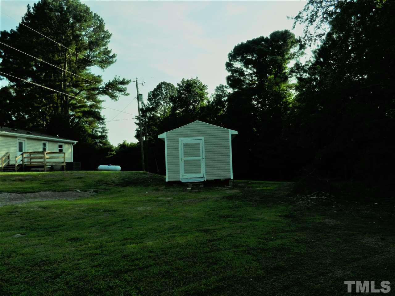 11916 Us 64 A Spring Spring Hope, NC 27882 - Photo 23 of 25 a backyard of a house with lots of green space and garden