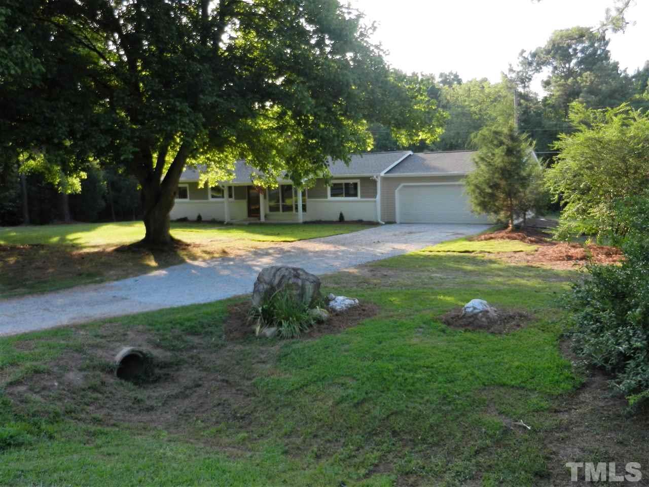 11916 Us 64 A Spring Spring Hope, NC 27882 - Photo 24 of 25 a view of a house with yard and garage
