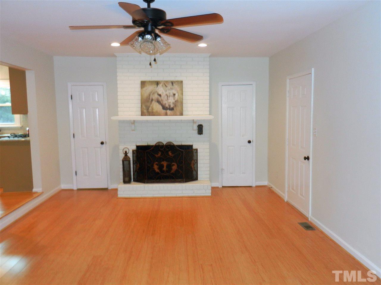 11916 Us 64 A Spring Spring Hope, NC 27882 - Photo 4 of 25 a big room with chandelier and a fireplace
