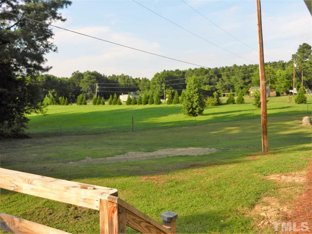 11916 Us 64 A Spring Spring Hope, NC 27882 - Photo 5 of 25 a view of a golf course with a lake