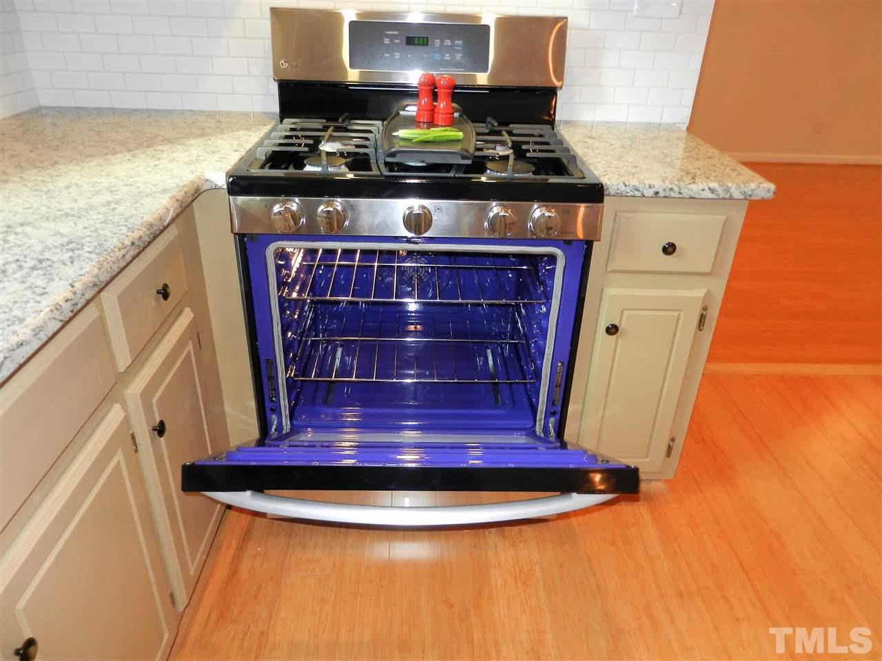 11916 Us 64 A Spring Spring Hope, NC 27882 - Photo 6 of 25 a view of a stove with granite countertop