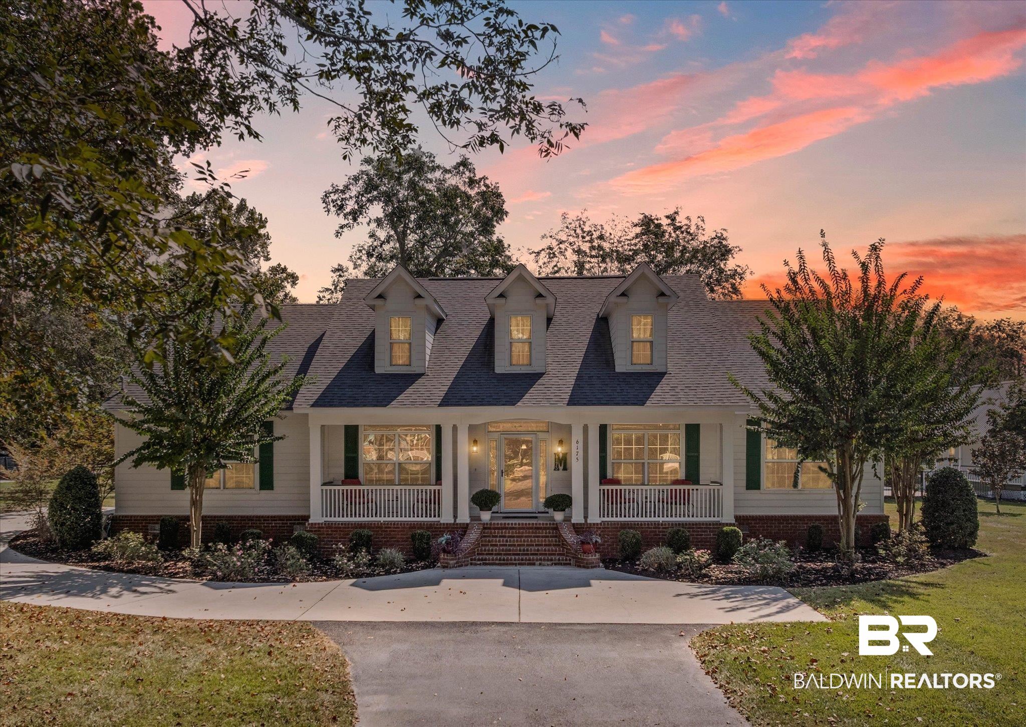 6175 South Grand Bay Wilmer Road Grand Bay, AL 36541 - Photo 1 of 42 Cape cod home with covered porch, a shingled roof, a lawn, and driveway