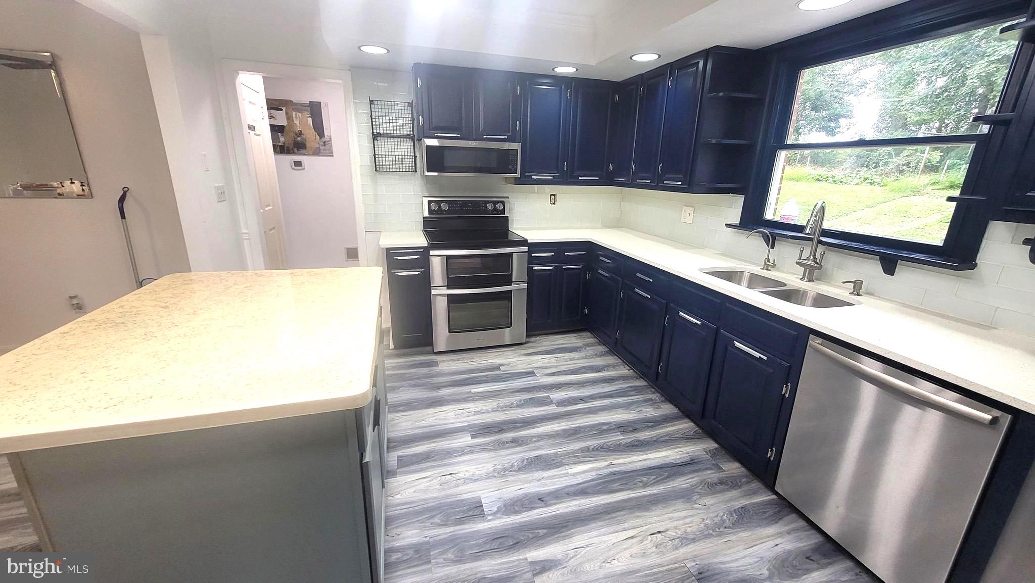 1815 Manchester Road Westminster, MD 21157 - Photo 3 of 45 Modern kitchen with navy cabinetry.