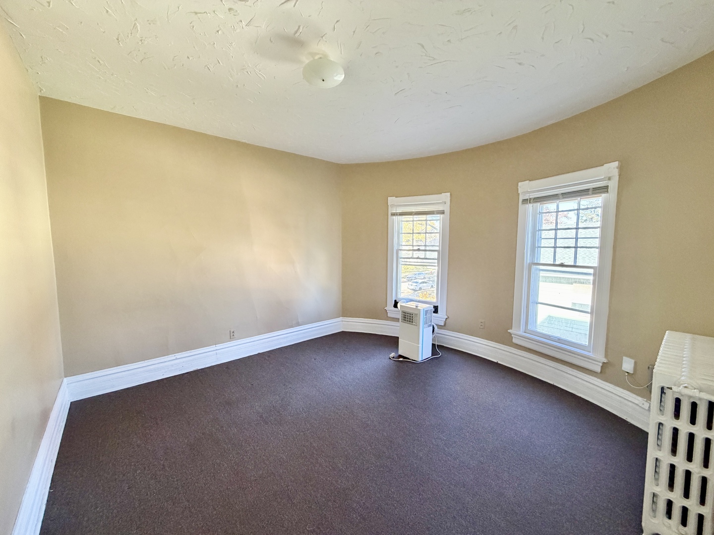 1105 Morton Avenue, Unit 3 Elgin, IL 60120 - Photo 2 of 8 an empty room with windows