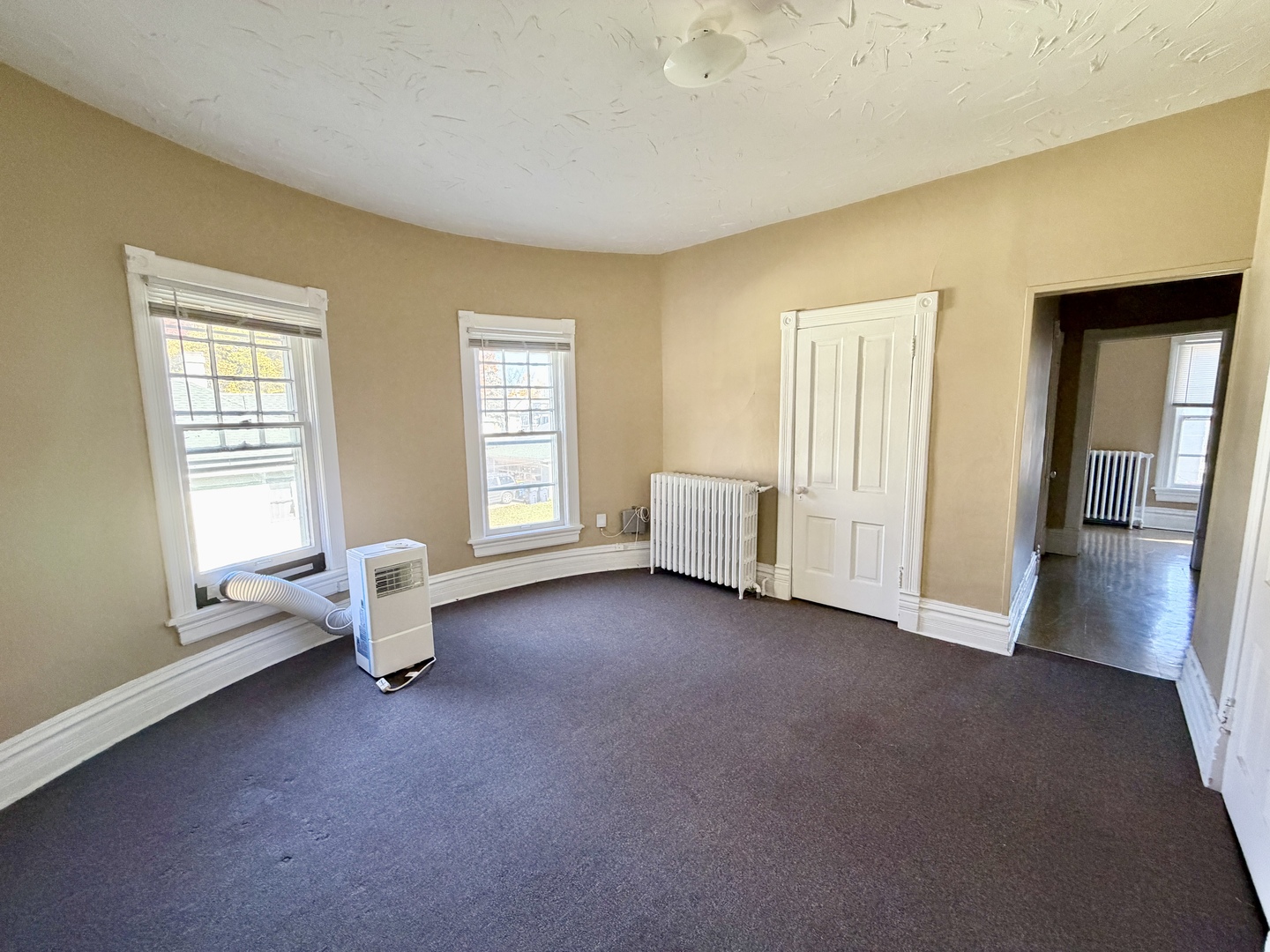 1105 Morton Avenue, Unit 3 Elgin, IL 60120 - Photo 3 of 8 a living room with furniture and windows