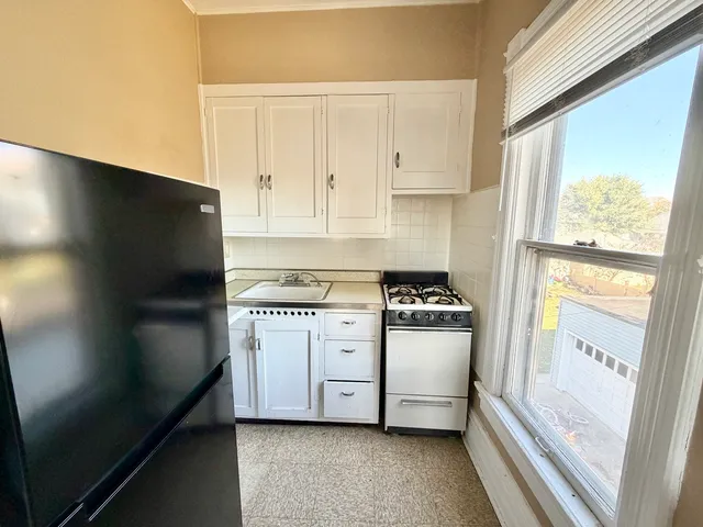 a kitchen with a stove microwave and refrigerator