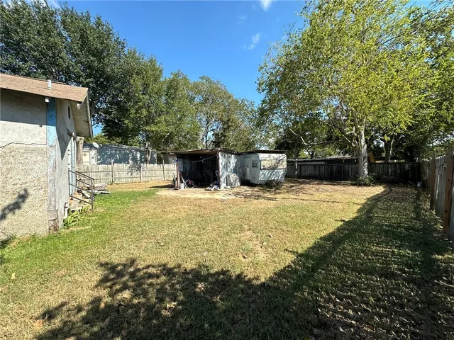 a swimming pool with wooden fence