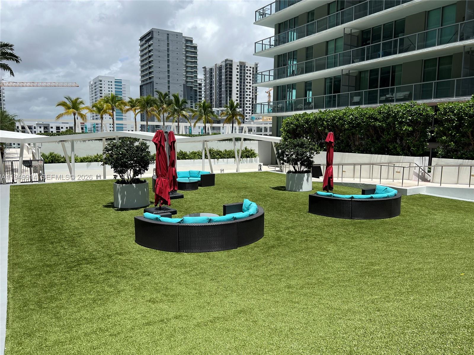 79 Southwest 12th Street, Unit 1704S Miami, FL 33130 - Photo 11 of 20 a view of a city with tall buildings and a big yard