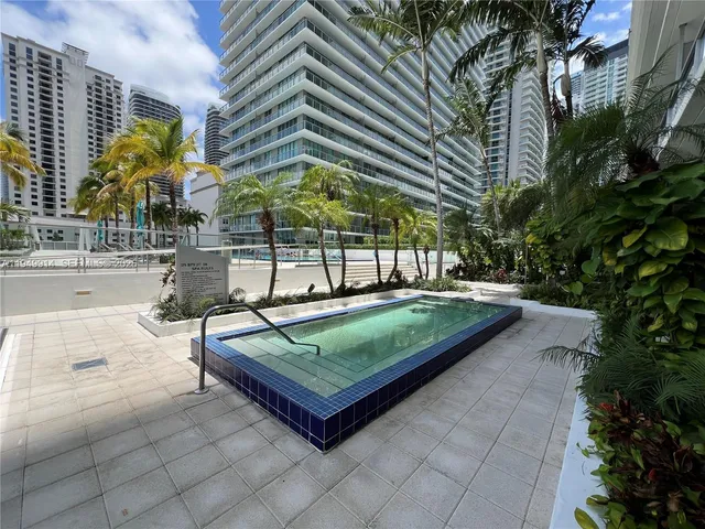 a view of outdoor space with swimming pool and furniture