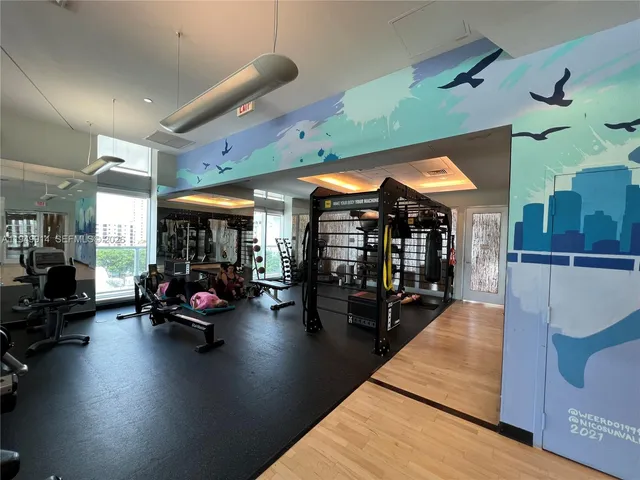 a view of a living room with gym equipment