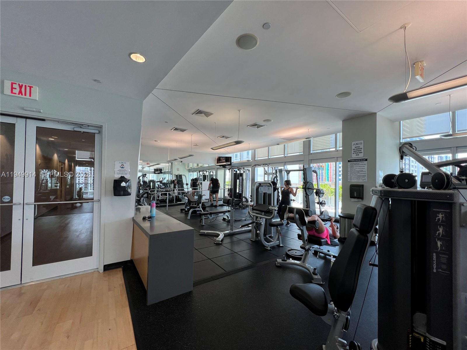 79 Southwest 12th Street, Unit 1704S Miami, FL 33130 - Photo 20 of 20 a view of a living room with gym equipment