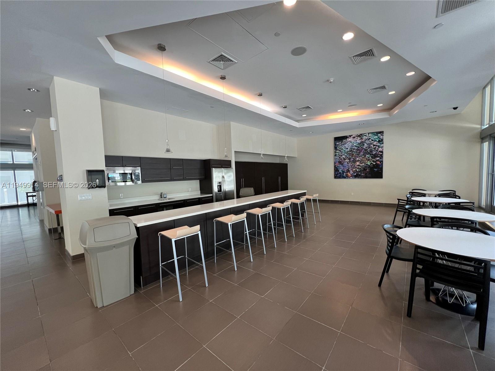 79 Southwest 12th Street, Unit 1704S Miami, FL 33130 - Photo 7 of 20 a group of chairs sitting in kitchen and kitchen