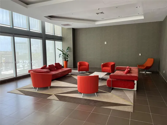 a view of a backyard with furniture and outdoor seating