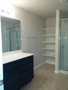 a room with a cabinets and a sink