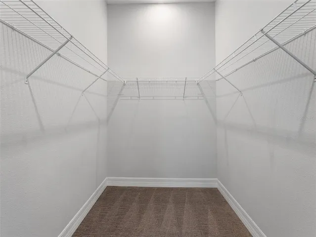 a view of a room with racks on the wall
