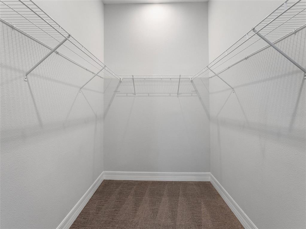3421 West Horatio Street, Unit 109 Tampa, FL 33609 - Photo 12 of 20 a view of a room with racks on the wall