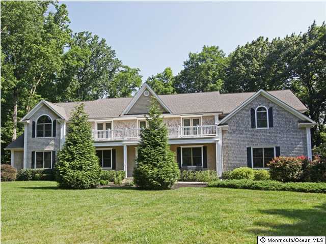 20 Saddle Ridge Road Colts Neck, NJ 07722 - Photo 1 of 3 a front view of a house with a yard