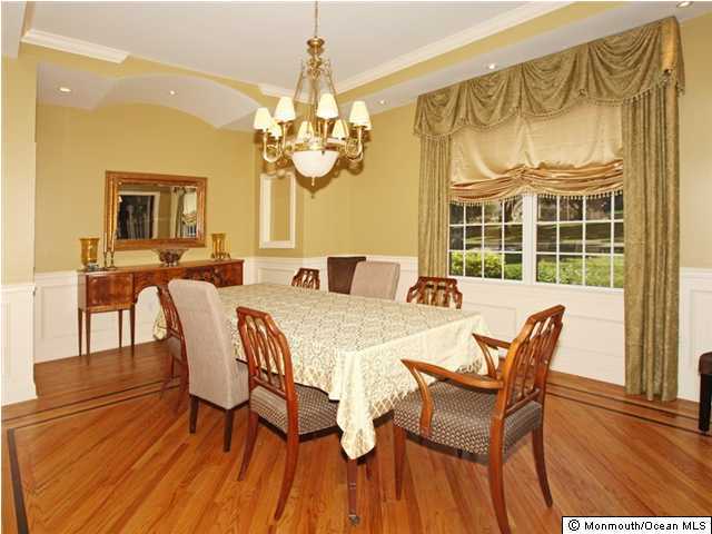 20 Saddle Ridge Road Colts Neck, NJ 07722 - Photo 2 of 3 a view of a dining room with furniture a chandelier and wooden floor