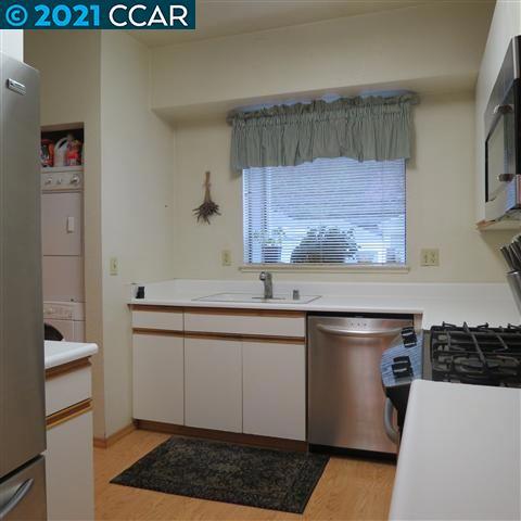 2683 Oak Road Walnut Creek, CA 94597 - Photo 11 of 19 a kitchen with stainless steel appliances a stove a sink and a refrigerator