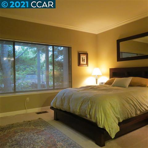 2683 Oak Road Walnut Creek, CA 94597 - Photo 15 of 19 a bedroom with a bed and window