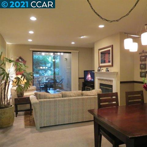 2683 Oak Road Walnut Creek, CA 94597 - Photo 8 of 19 a living room with fireplace furniture and a flat screen tv