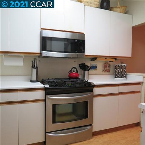 2683 Oak Road Walnut Creek, CA 94597 - Photo 10 of 19 a kitchen with stainless steel appliances granite countertop a stove and a microwave