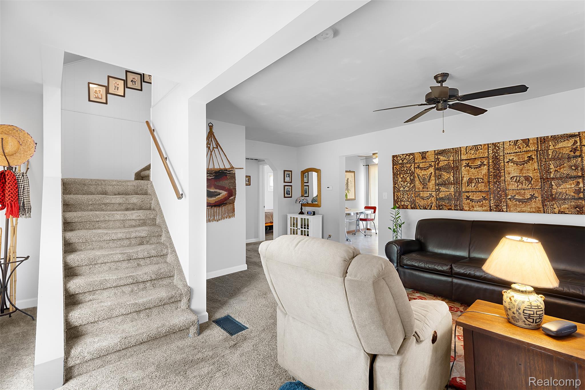 22827 Meridian Road Grosse Ile, MI 48138 - Photo 15 of 36 Carpeted living room with ceiling fan and arched walkways