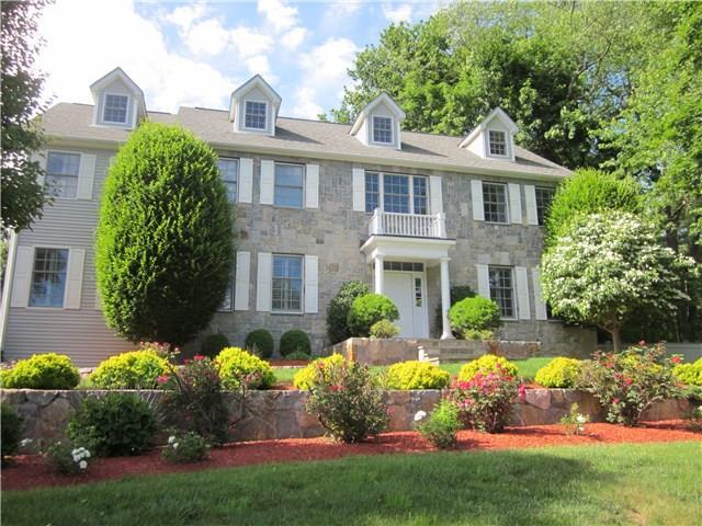 8 Calumet Road Westport, CT 06880 - Photo 1 of 1 a front view of house with yard and green space