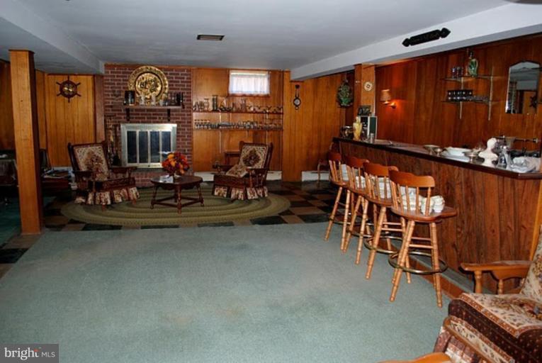233 Coldbrook Road Lutherville-Timonium, MD 21093 - Photo 12 of 22 Raised Hearth Fireplace and Bar