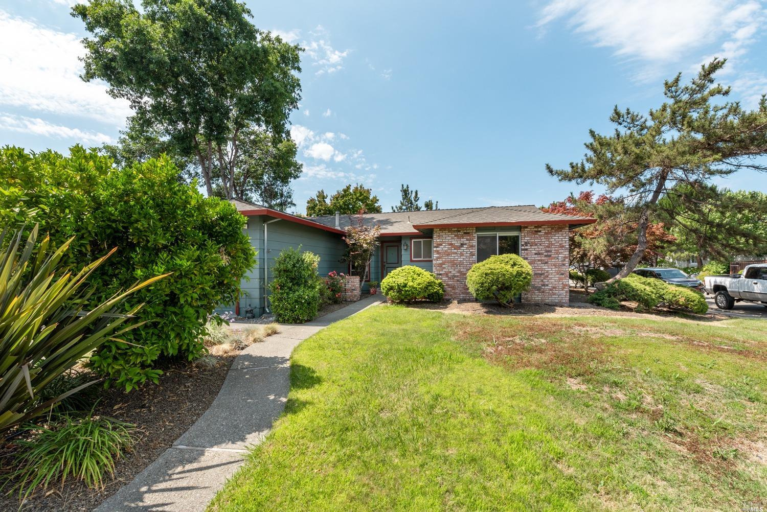 4983 Filament Street Rohnert Park, CA 94928 - Photo 1 of 1 a front view of a house with a yard and trees