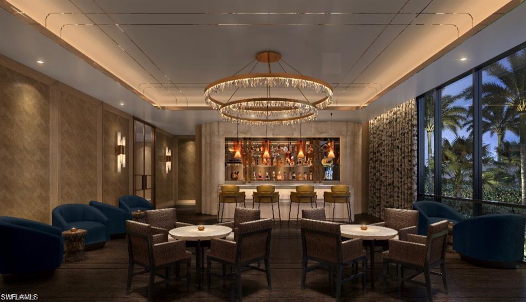 6869 Grenadier Boulevard, Unit 1004 Naples, FL 34108 - Photo 7 of 11 a view of a dining room with furniture window and outside view