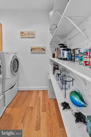 a large bed sitting in a bedroom and table