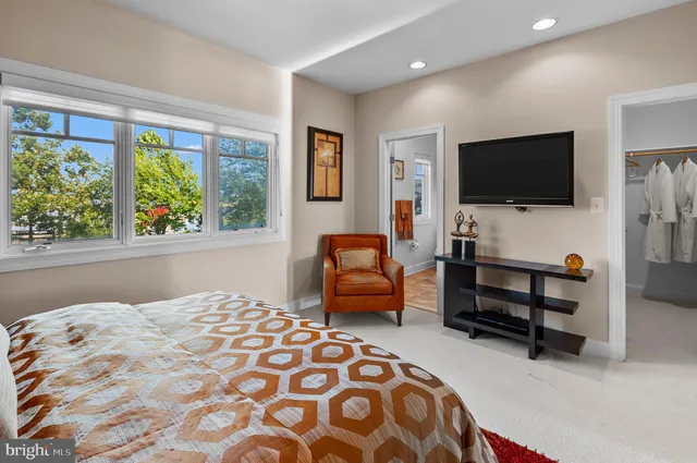 a view of a balcony with wooden floor and fence