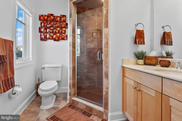 a bedroom with a bed and a television