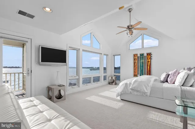 a view of a balcony with wooden floor and fence