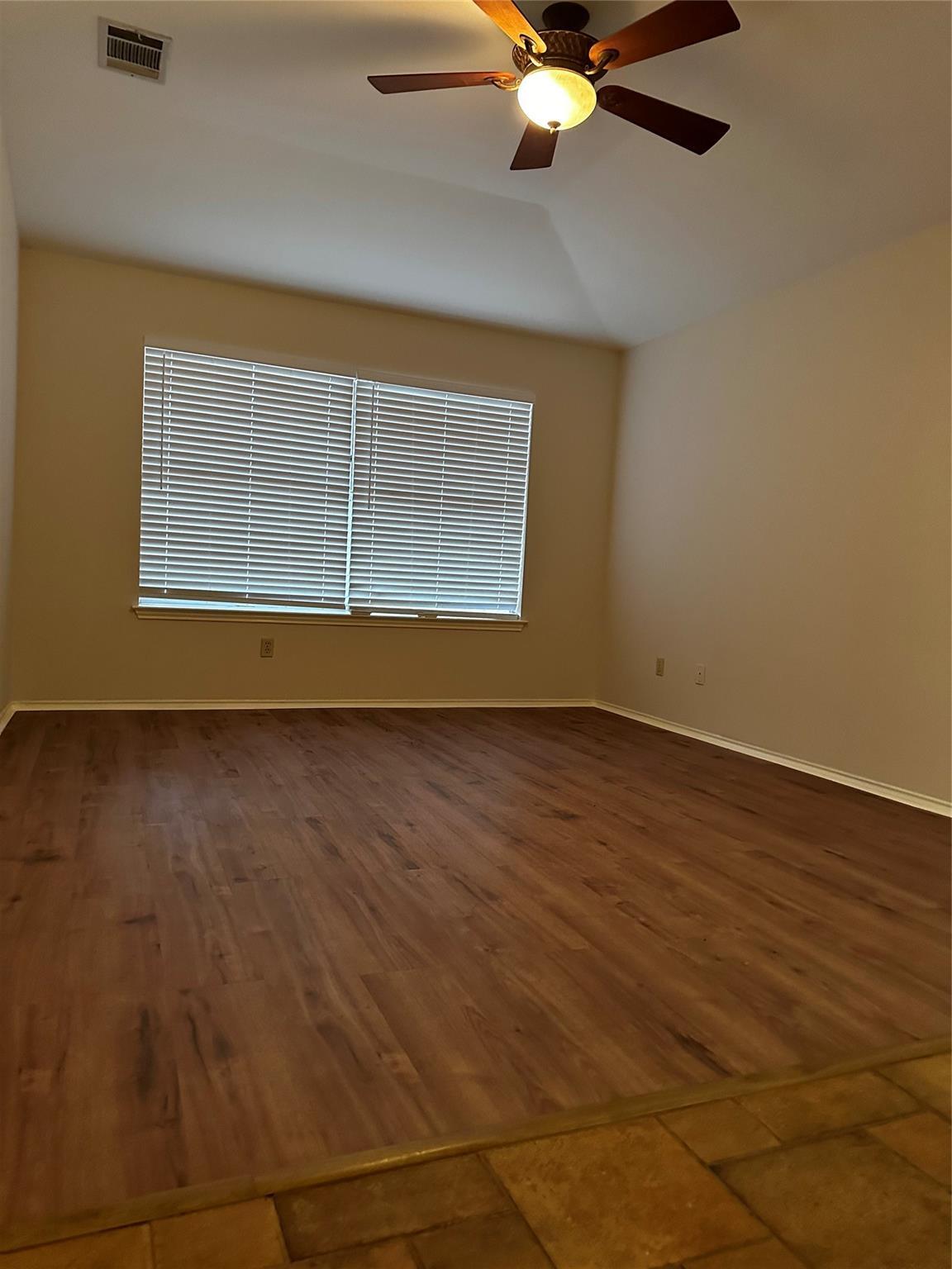 8007 Bounty Trail Austin, TX 78749 - Photo 18 of 32 A versatile living space with robust flooring and practical window coverings awaits.