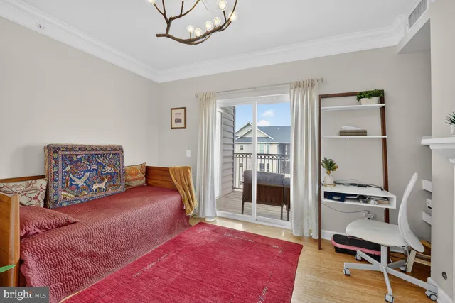 a bedroom with furniture and a book shelf
